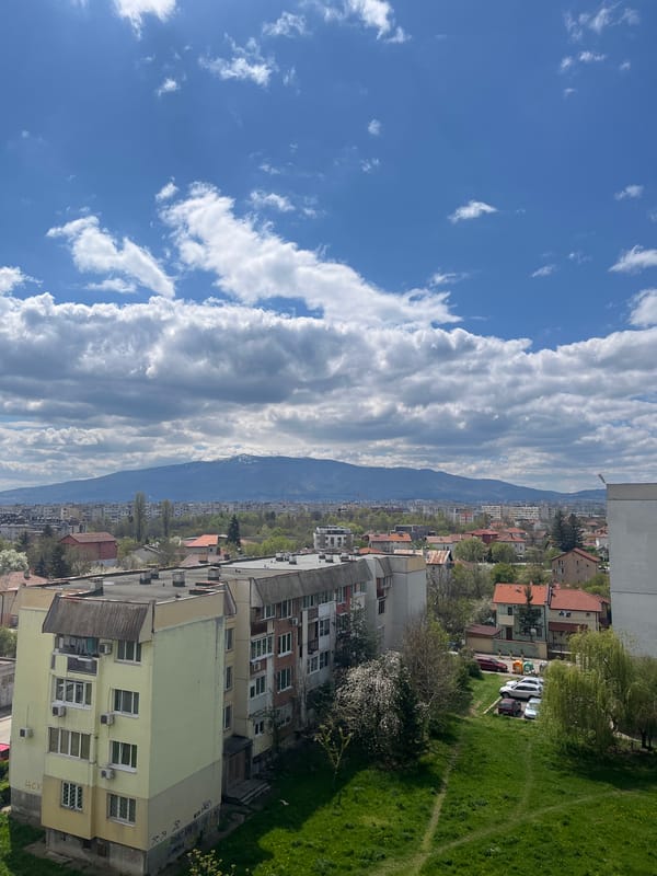 Sofia cityscape documented under spring skies with mountain backdrop