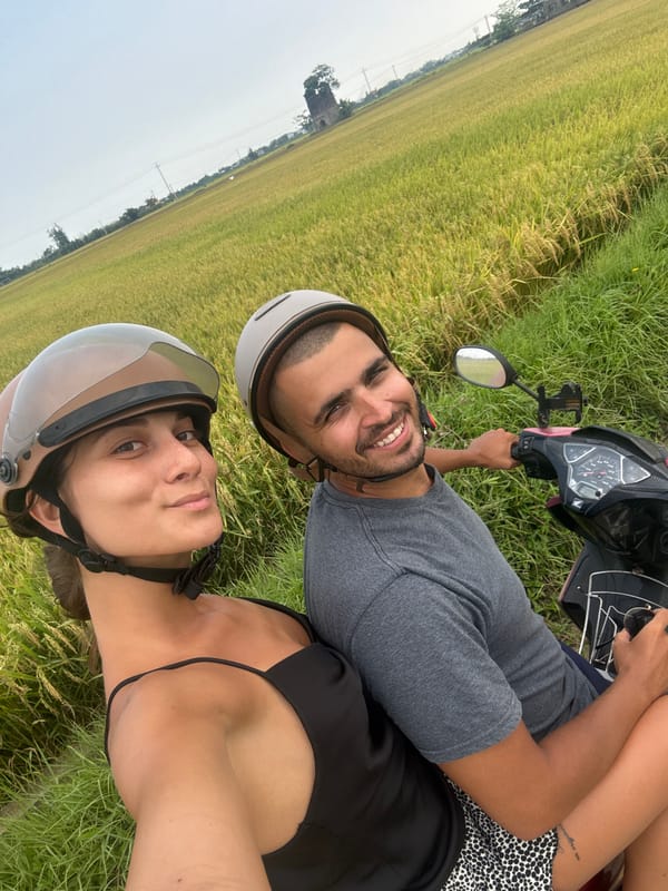 Couple documents scooter ride through Vietnam rice paddies