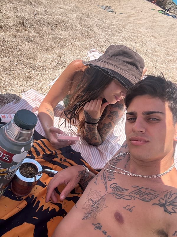 Tattooed beach day on the Catalan coast