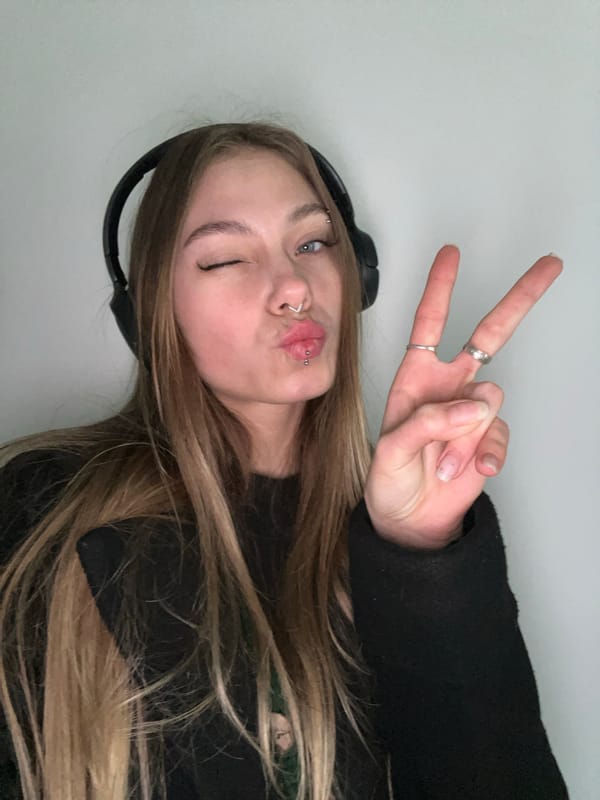 Woman makes peace sign gesture in Russian town