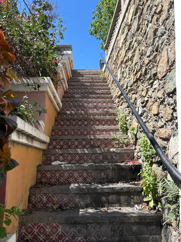Geometric tiled stairs with metal railing observed in Mazatlán