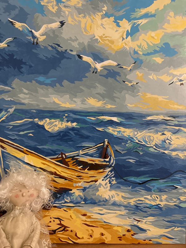 Artistic moments captured: seascape painting and rose bouquet display