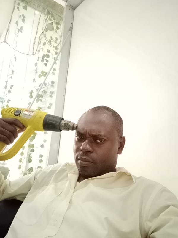 Man Uses Heat Gun Device Indoors in Gwarinpa
