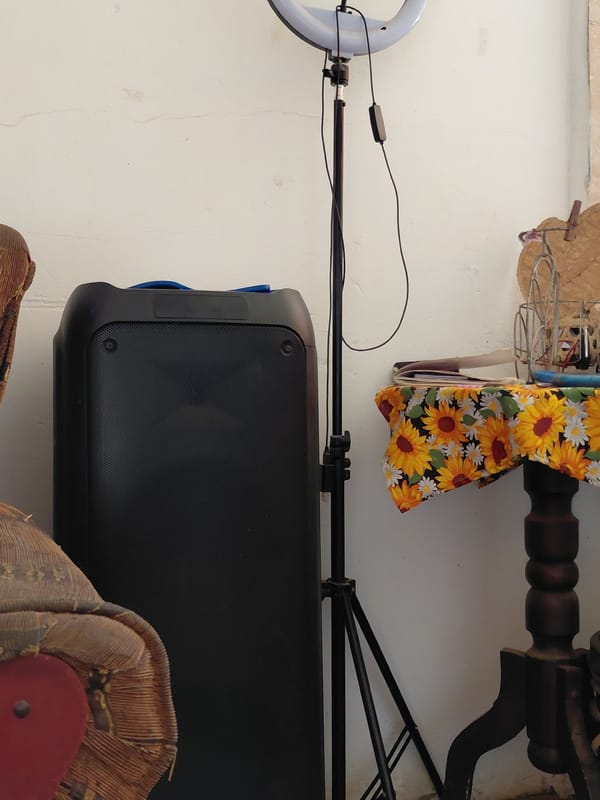 Person documented in indoor space with furniture, recording equipment