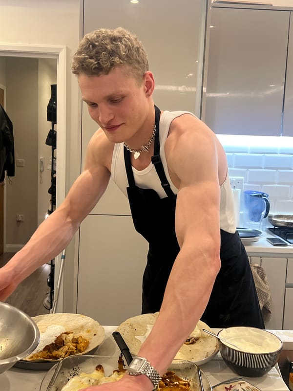 Evening cooking gathering captured in modern London kitchen