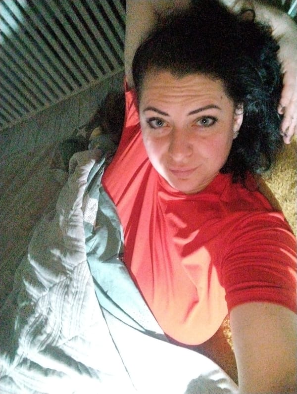 Woman exercises at home with pets in Grishanki