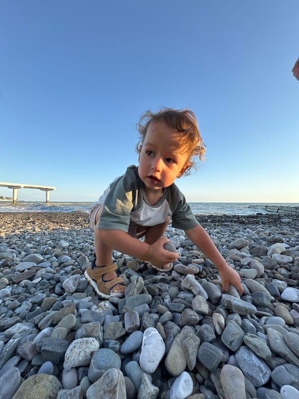 Golden hour on a Sochi pebble beach, summer evening