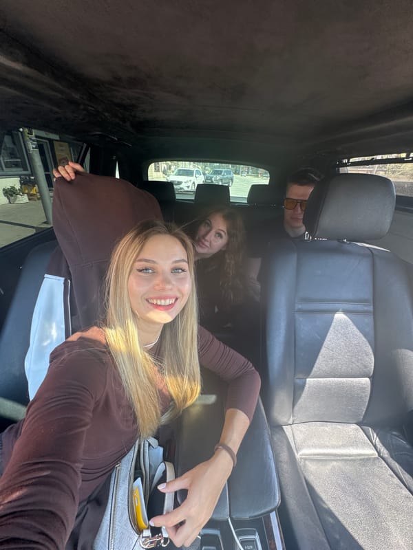Three people photographed inside car in New Athos, Abkhazia