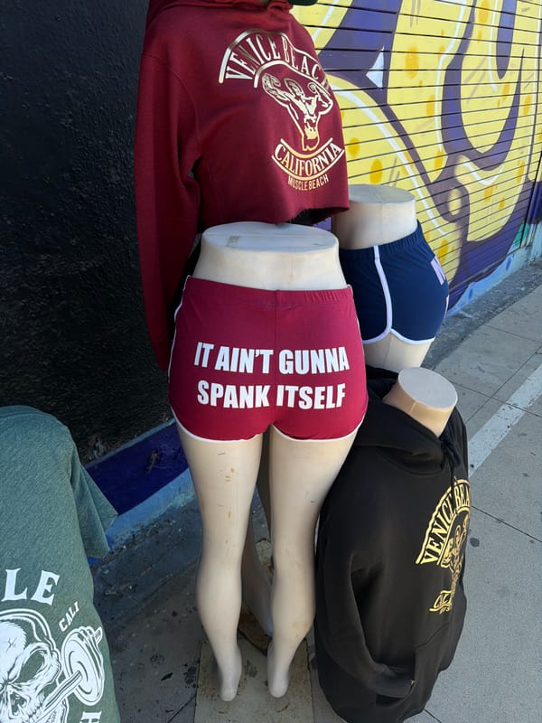 Street vendors display clothing on mannequins at LA market