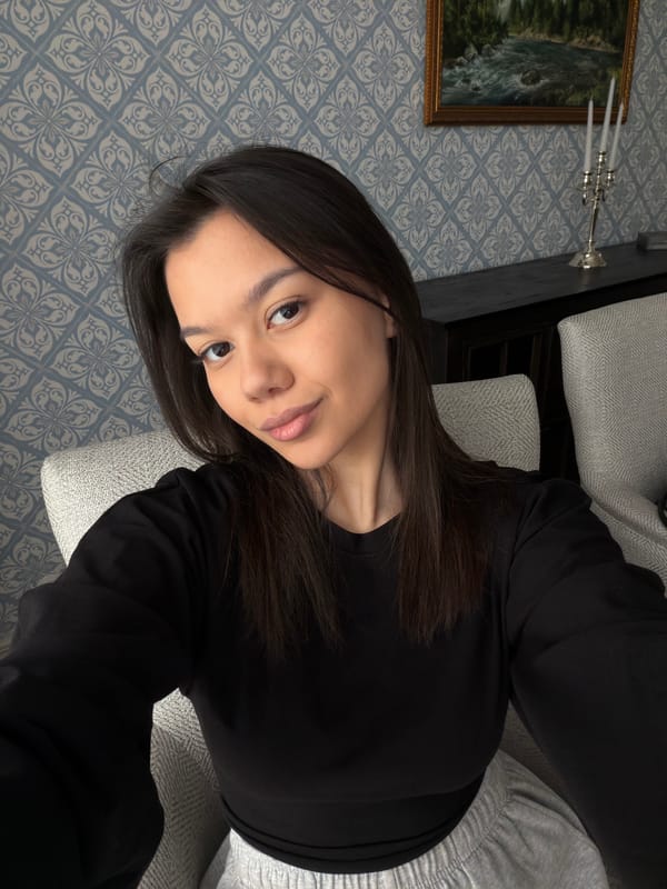 Woman relaxes at home with coffee in Krasnoyarsk