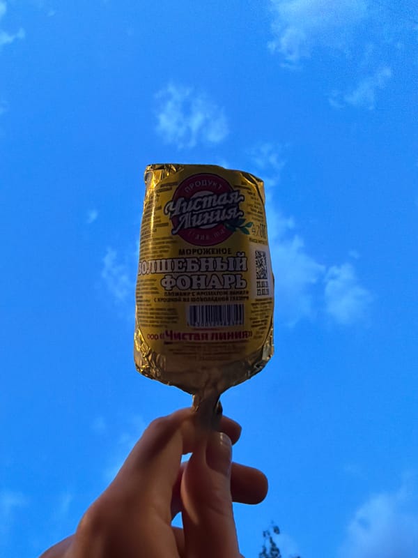 Moscow resident enjoys ice cream sandwich on spring evening