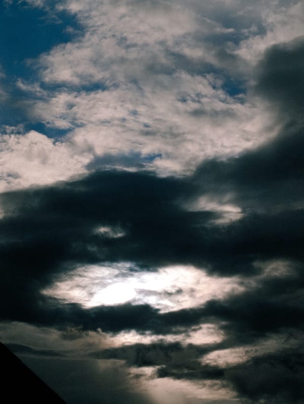 Storm clouds gather over open roads, cheesecake gets finished indoors