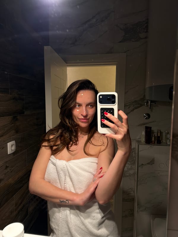 Woman takes bathroom selfies during skincare routine in Budva