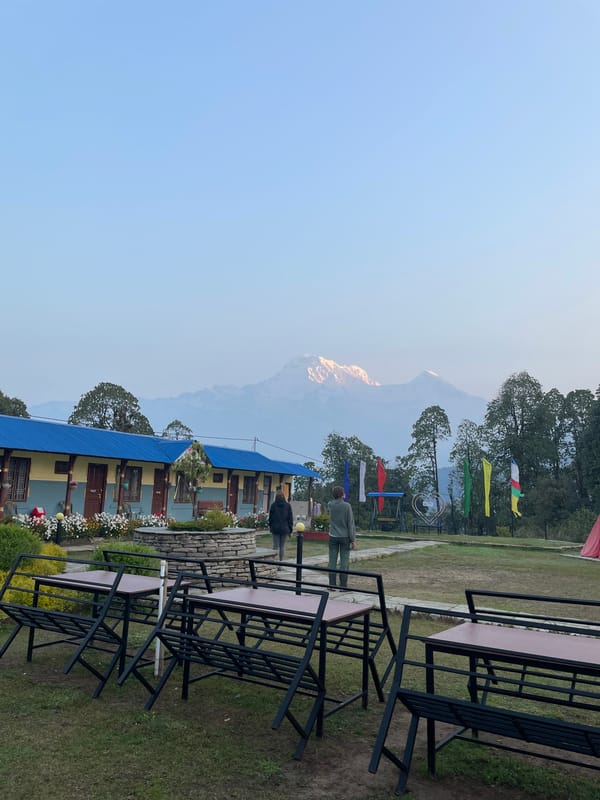 Blue-roofed building with outdoor furniture captured in Bhindabari, Nepal