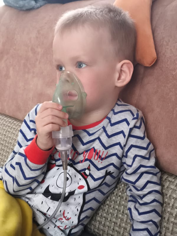 Child receives nebulizer treatment at home in Russia