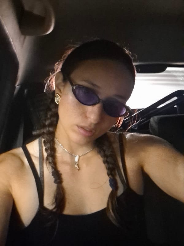 Woman in sunglasses observed in vehicle in Buenos Aires