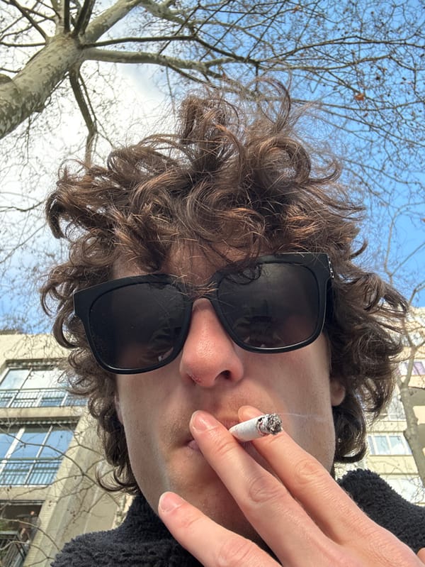 Person takes selfies on Paris street Monday morning
