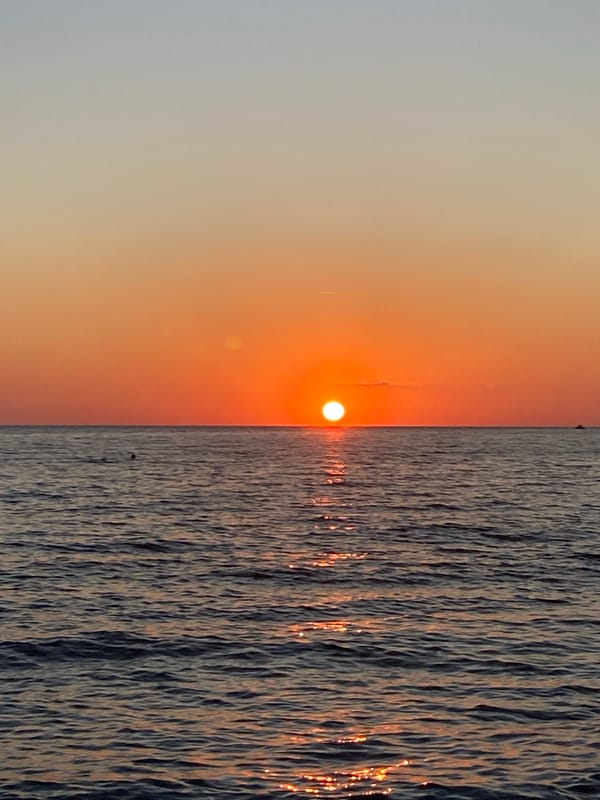 Young man plays with waves at Bar beach