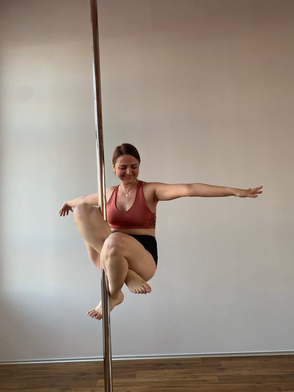 Woman practices pole dancing at Yekaterinburg fitness facility