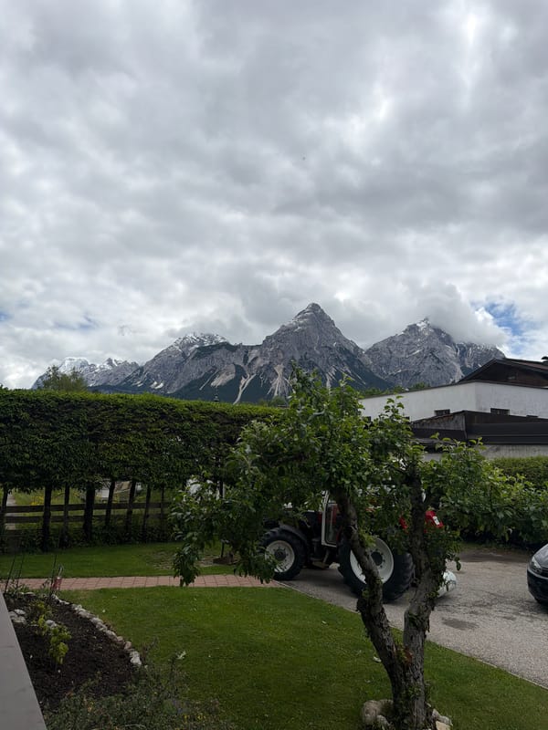 Overcast mountain landscape with snow patches documented by witness