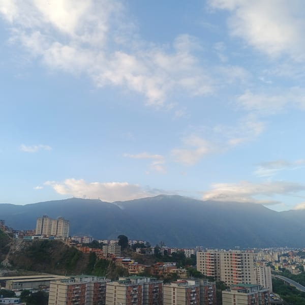 Caracas cityscape and child documented in evening hour