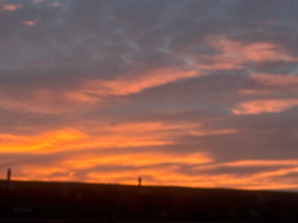Colorful sunrise observed over Great Yarmouth rooftops