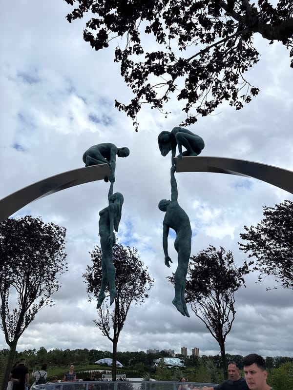 Bronze figure sculptures reach outward in Krasnodar public space