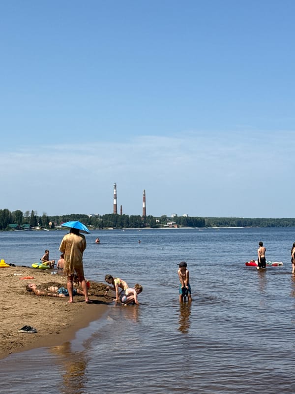 Relaxed beach day with swimming, selfies, and paddleboarding