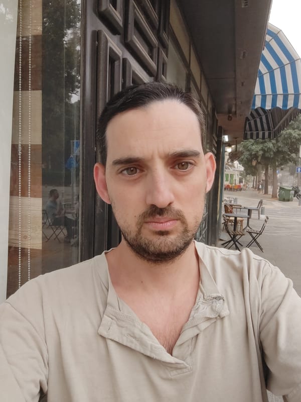 Man photographed near toy-covered table in Tel Aviv