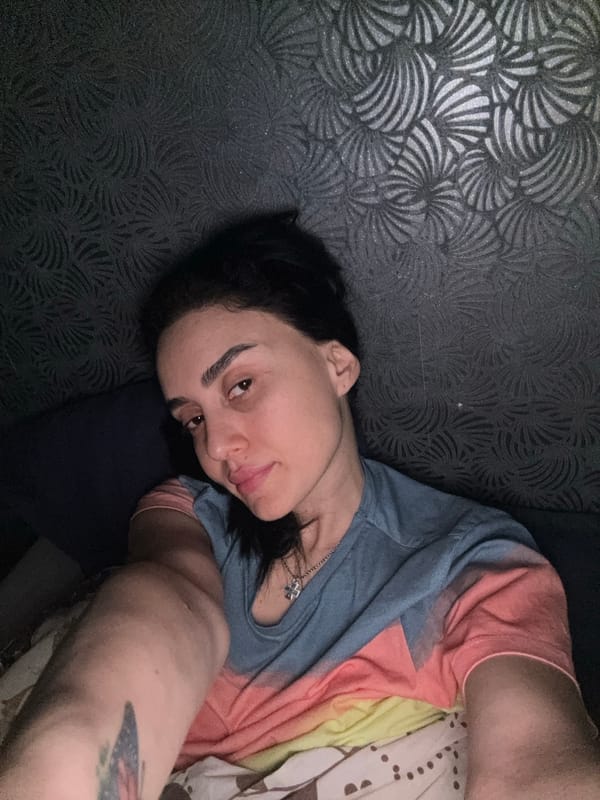 Person rests on patterned surface in Tbilisi