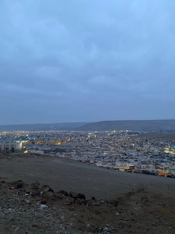 Nighttime view captured of hillside residential area in Arica, Chile