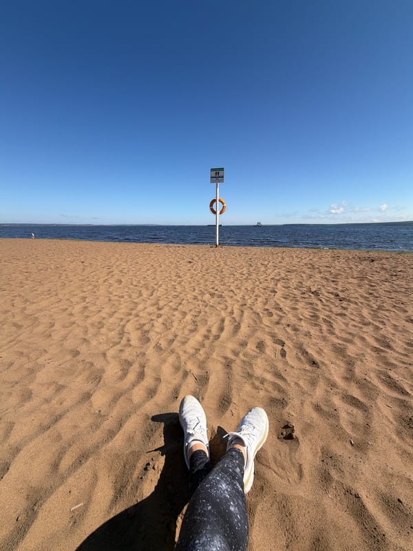 Woman practices early morning yoga on Chaikovsky beach boardwalk