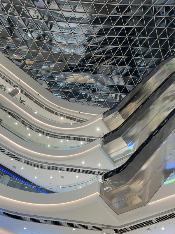 Shoppers browse modern mall in Khabarovsk during midday visit