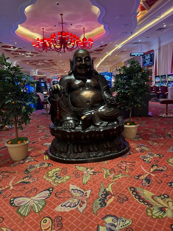 Bronze Buddha statue displayed with decorative elements in Shkotovo
