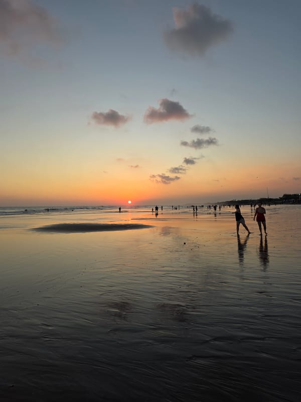 Kuta Beach sunset draws a crowd to the shoreline