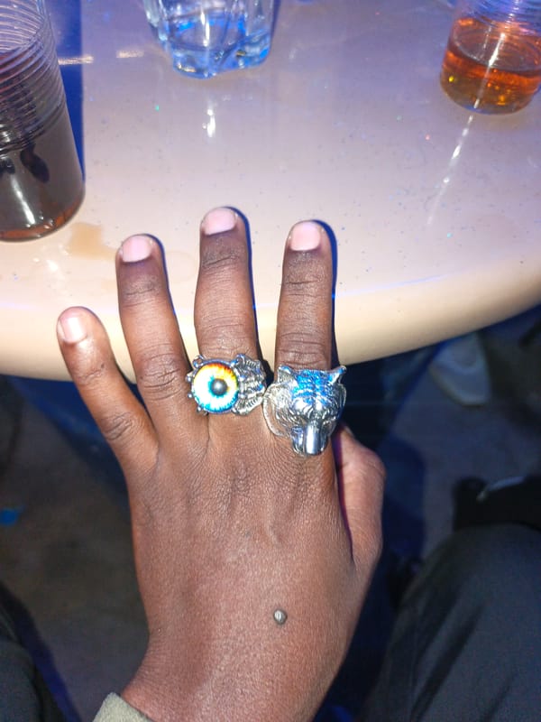 Bar patrons socialize and play pool in Nairobi