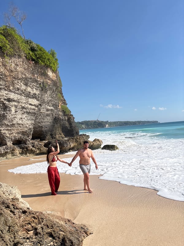 Morning beachgoers enjoy sunny weather in Kuta Selatan, Indonesia