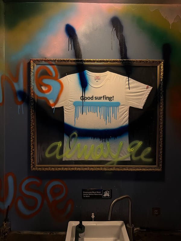 Graffitied bathroom wall photographed in South Korean township