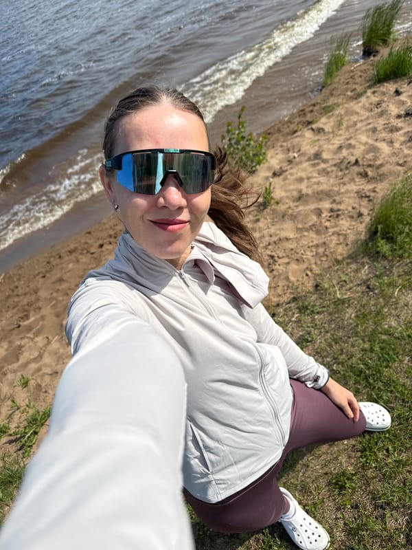 Women enjoy sunny morning at Chaikovsky waterfront, taking selfies