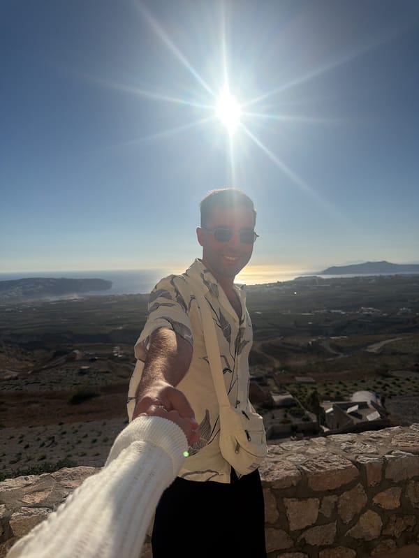 Handholding and coastal views on a Santorini afternoon
