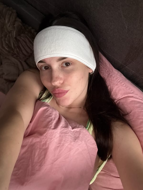Person documents recovery with playful selfies while wearing head bandage