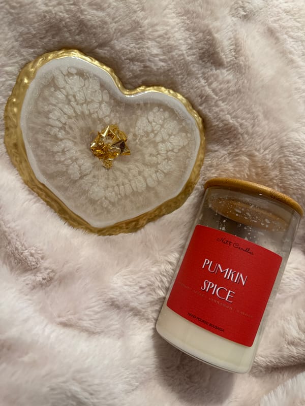 Cozy morning scene with candle and decorative coaster