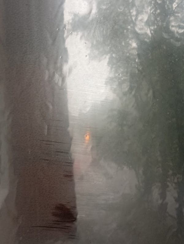 Heavy rain rolls through Minusinsk on a gray July morning