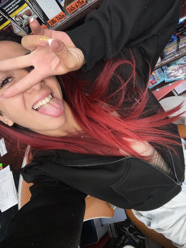 Red-haired woman makes peace sign in Sofia morning photo