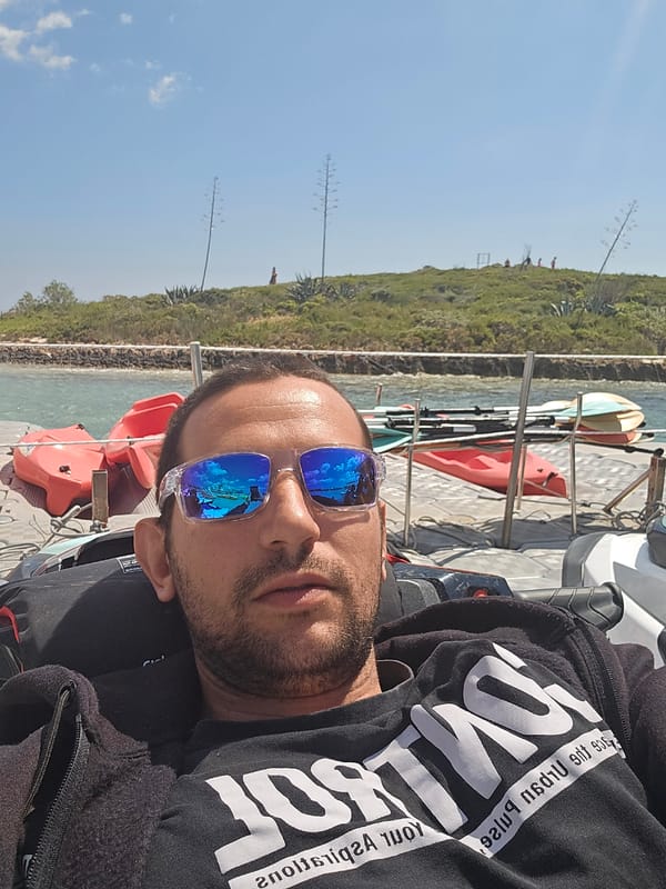 Man relaxes on dock in Ayia Napa marina