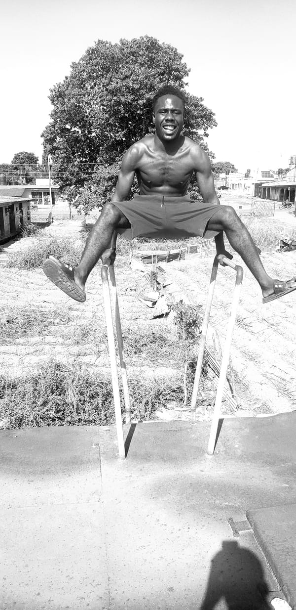 Man performs gymnastics on parallel bars in Narayi, Nigeria