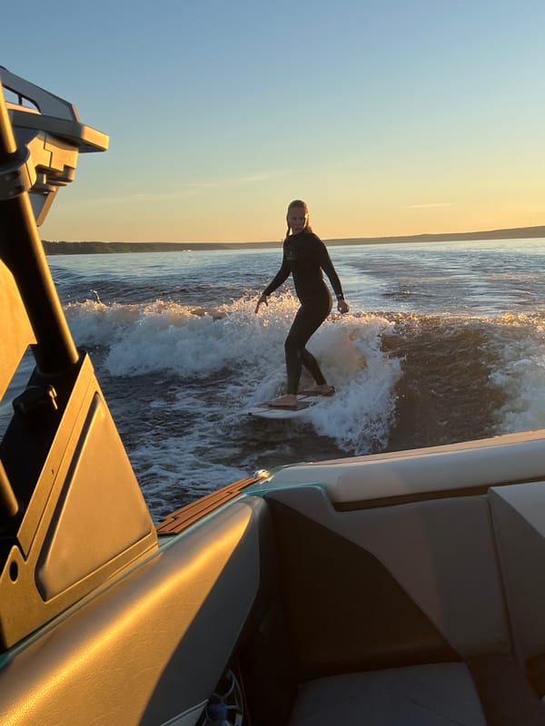 Wake surfing at sunset on Lake Gromovskoye, Russia