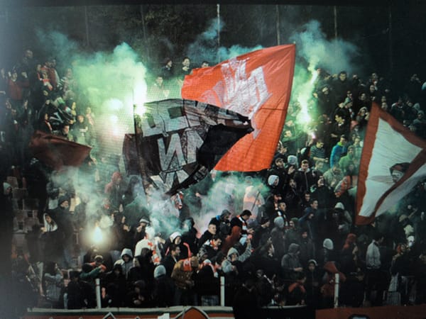 Passionate fans gather for intense nighttime soccer match