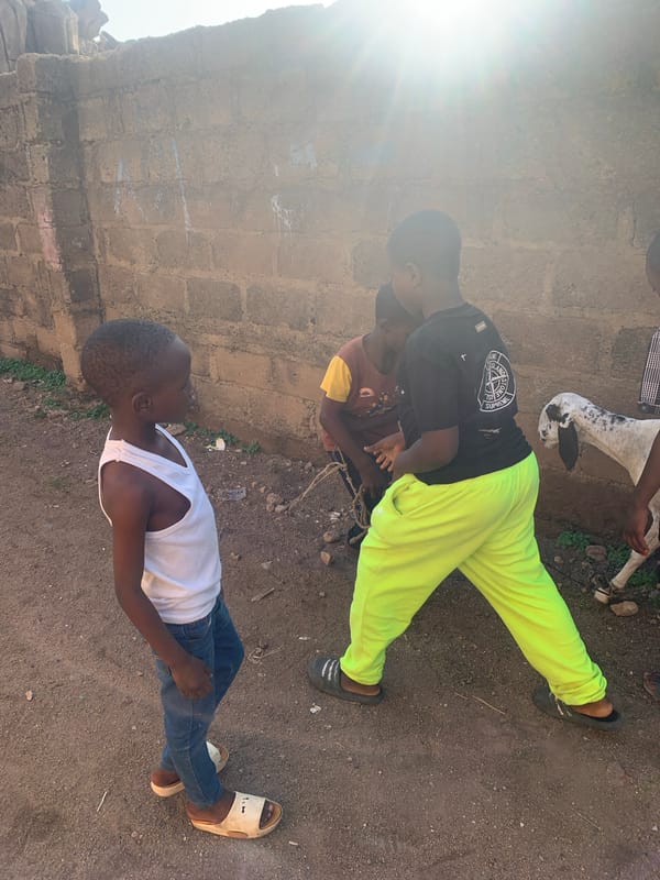 Daily life unfolds on Jos streets during afternoon hours