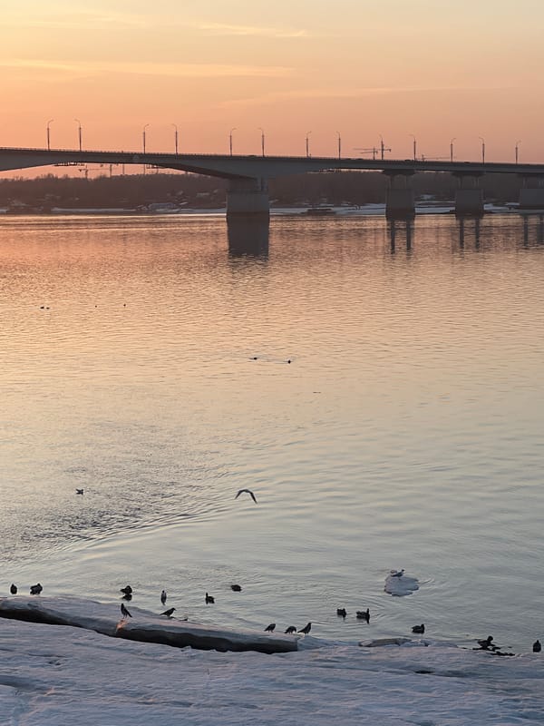 Sunset scene at Perm train station with pedestrians